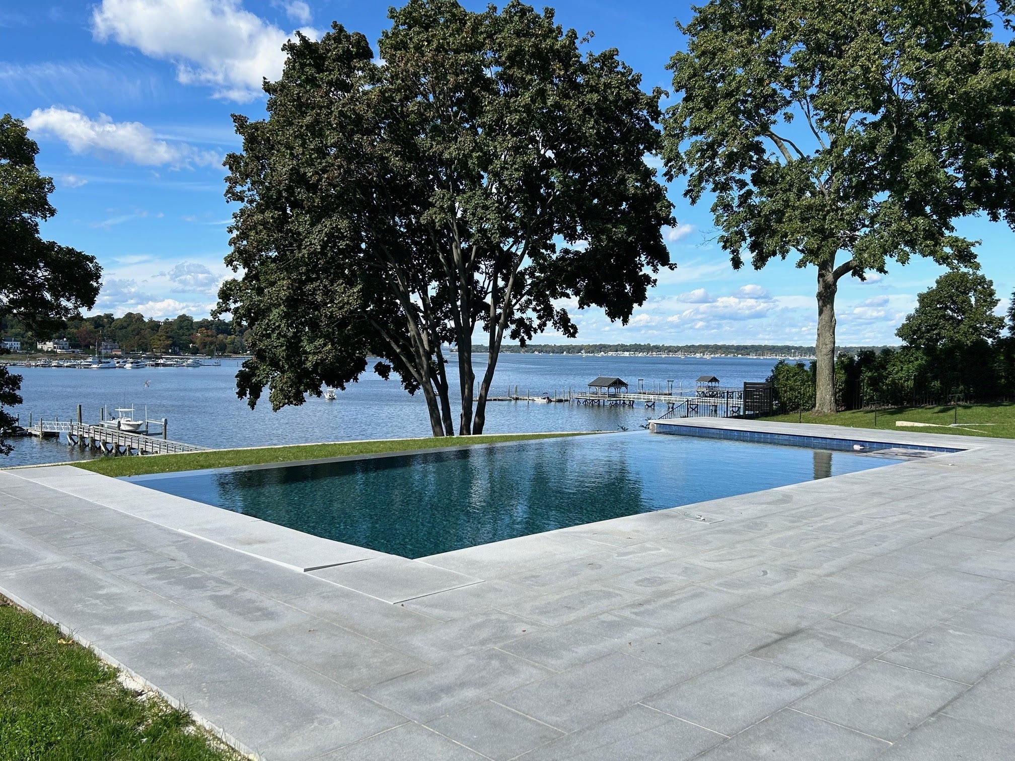 Open infinity pool overlooking the lake in summer